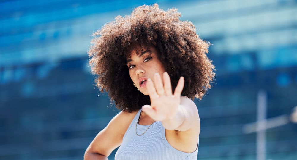 A black woman experienced healthy hair growth after she started using moisturizing deep conditioners.