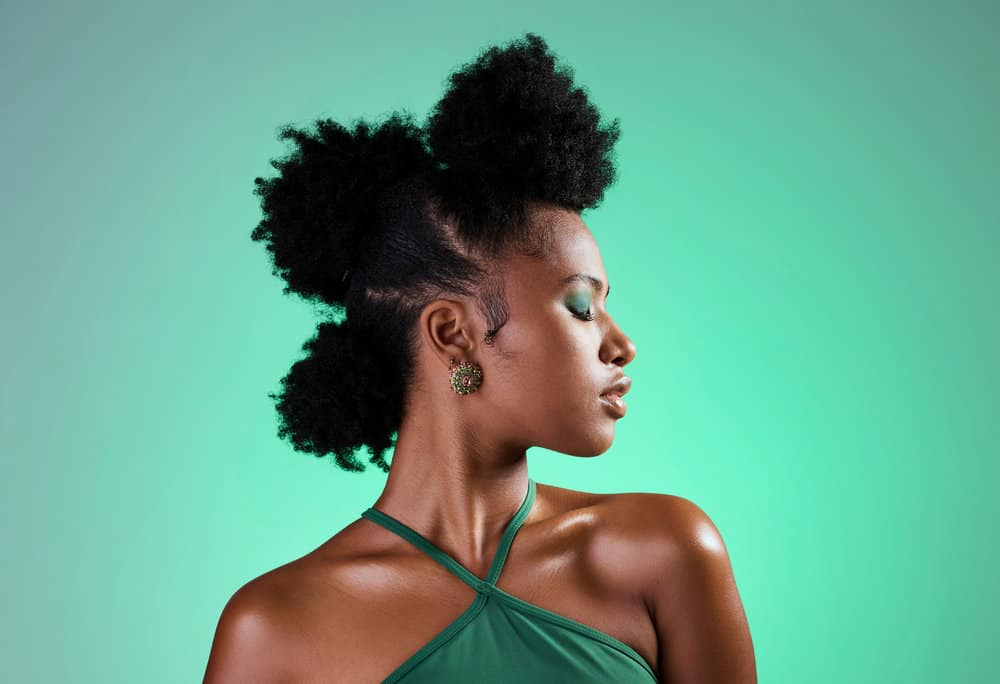 A lady with medium hair length has her curls adorned with beautiful hair jewelry and hair accessories.