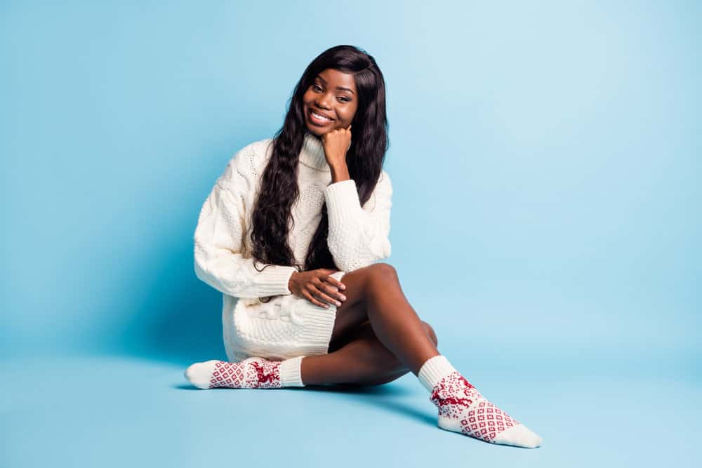 African American female with long hair wearing a medium-density full lace wig with natural-looking fullness.