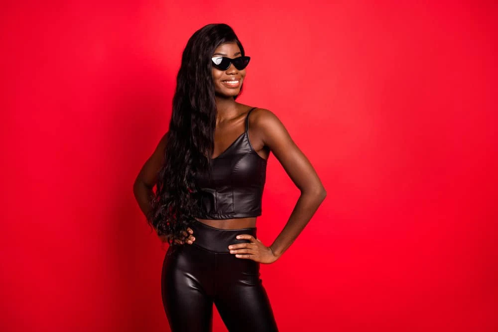 How Long Does Wig Glue Last? How to Make It Last Longer 4 A lovely black female wearing a chemically processed synthetic wig installed with waterproof adhesive.