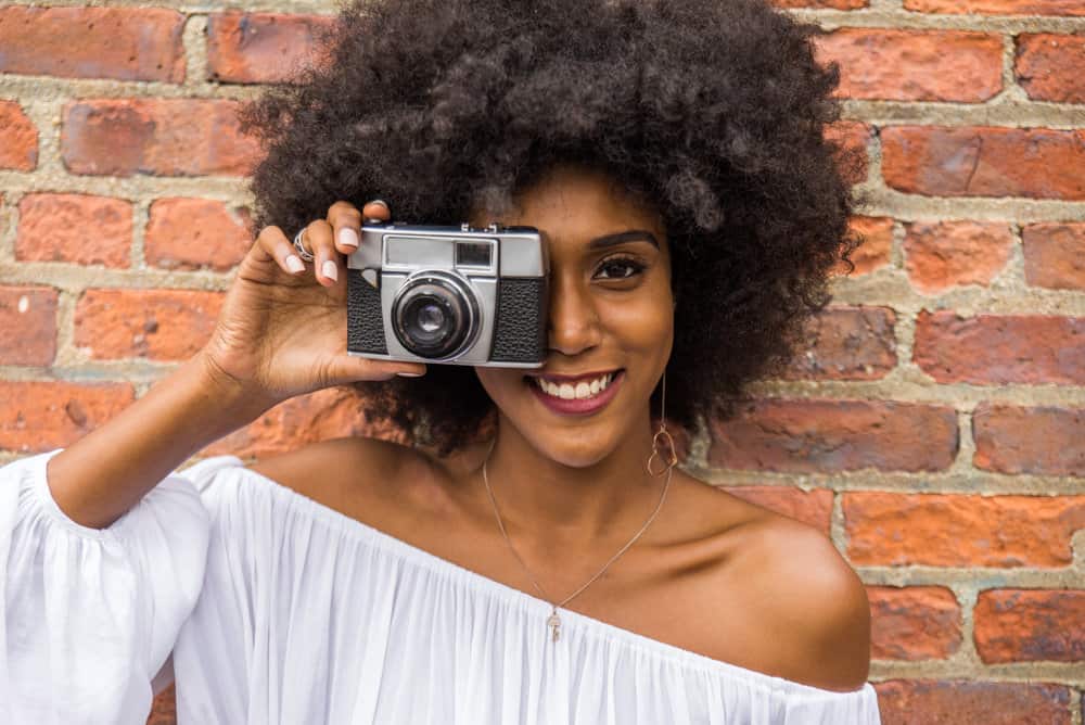 A beautiful African American female that keeps her hair moisturized with moisturizing shampoos and aloe vera juice.