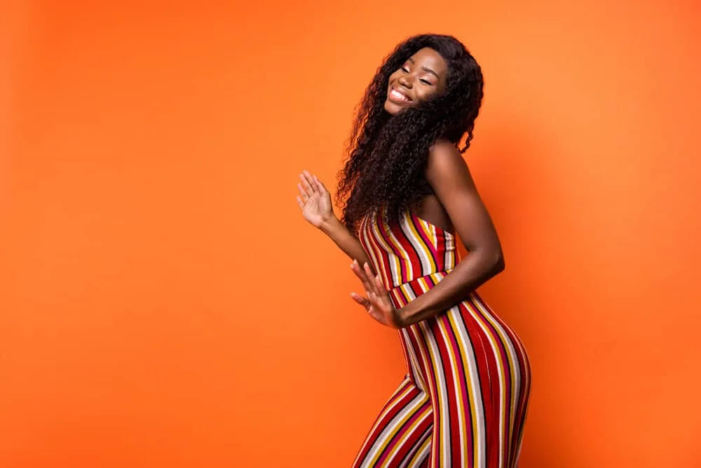 Is 150% Density Good for a Wig? How Thick Is a 150% Density Wig? 4 A beautiful black girl that's a wig lover is wearing a lace front wig made of natural human hair thickness.