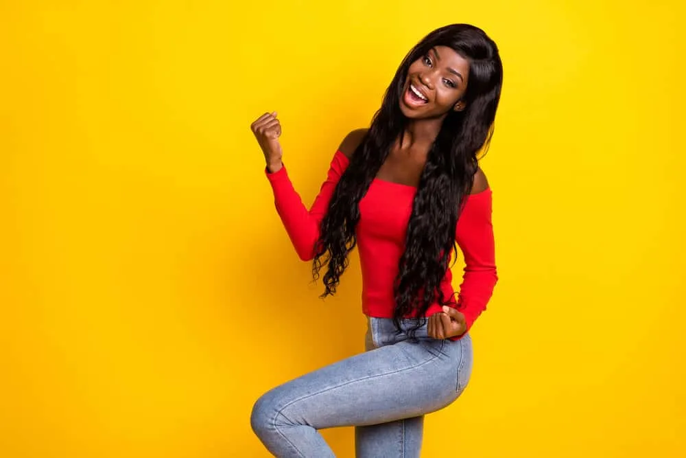 How to Put on a Lace Front Wig for Beginners: DIY Step-by-Step 3 An attractive black girl that loves wearing wigs and hair extensions to cover her own hair with protective styles.