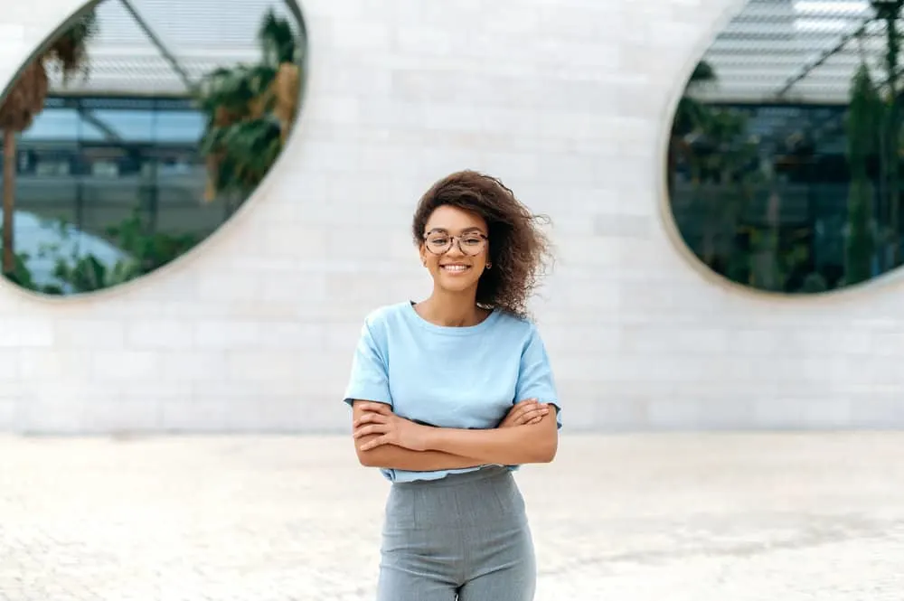 How to Fix Scraggly Hair: Detailed DIY Step-by-Step Guide 10 An elegant young female won a windy, rainy day making her damp hair stringy, limp, and frizzy.