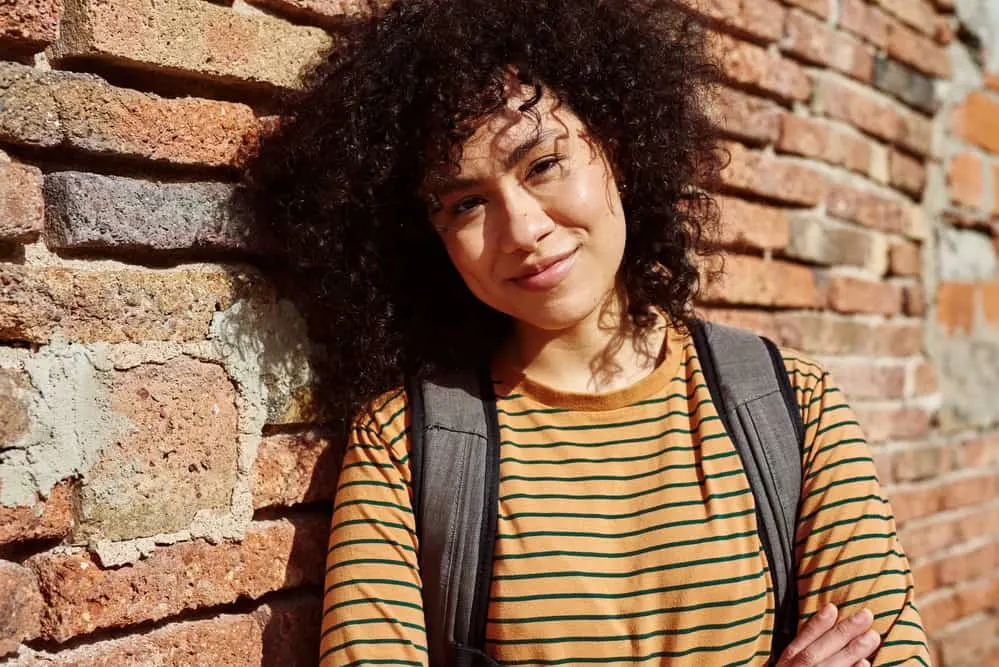 How to Clarify Curly Hair at Home: DIY Clarifying Guide 6 An African American female with a 3B hair type styled her hair after using a deep conditioning treatment.
