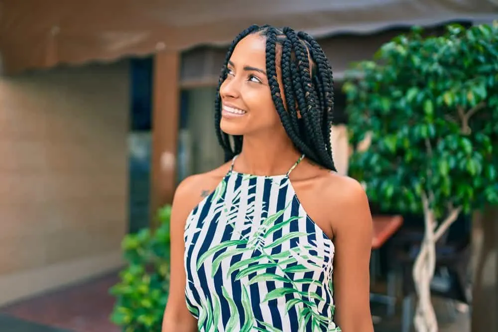 Protective Styles: How To Do a Protective Style on Natural Hair 7 Young female with a big smile walking through downtown New York City.