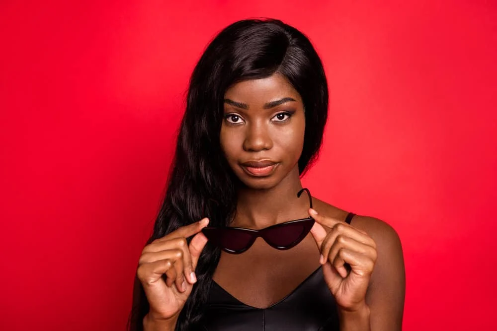 A young lady wearing a virgin human hair wig that lasts up to six weeks with a long-term adhesive.