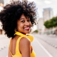 A black girl that keeps her normal hair soft by only using shampoo and conditioner products for curly or textured hair.