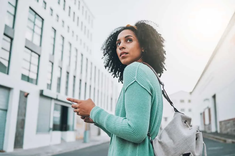 Co-Washing Hair Instead of Shampooing: DIY Step-by-Step 2 African American female with textured hair styled cleaned with a sulfate-free shampoo and styled with aloe vera gel.