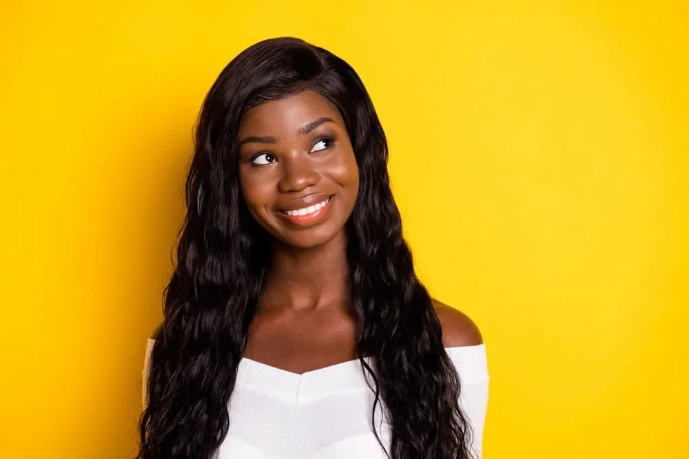 What Does Wig Density Mean? Wig Density Chart with Types 2 African American female wearing a lace wig with natural hair density looks very similar to human hair wigs.