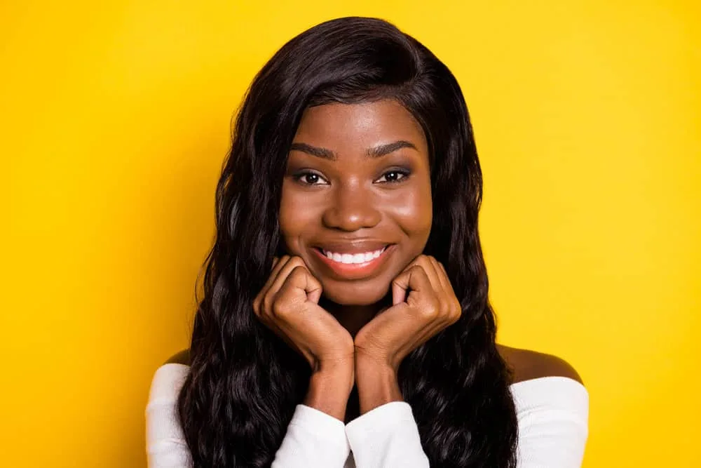 What Does Wig Density Mean? Wig Density Chart with Types 4 A pretty black female that loves wearing low-density wigs that accurately blend with her head of hair perfectly.