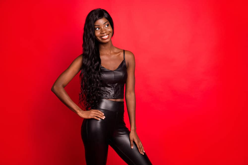 A thin young female wearing a lace frontal wig carefully attached with freeze spray for a six-week time period.