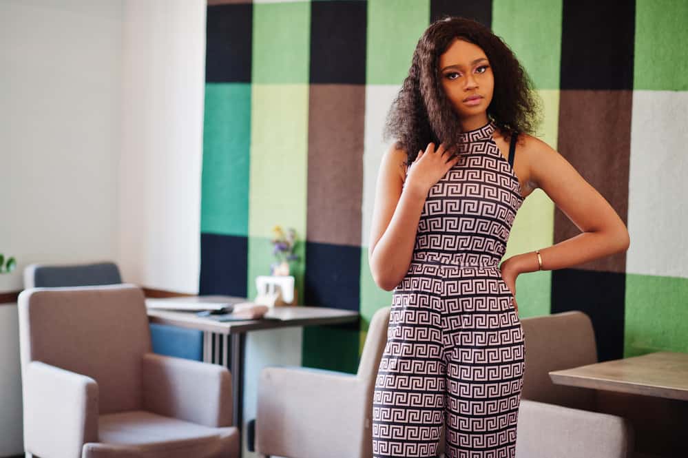 A stylish young black woman who used to wear wigs more often is starting to enjoy long waves again.