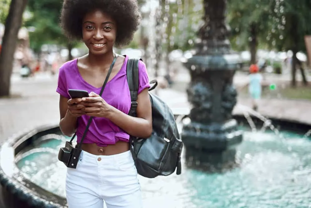 Why Does 4C Hair Shrink? How to Prevent Shrinkage on 4C Hair 6 A beautiful black female wearing her hair stretched and styled with a leave-in conditioner.