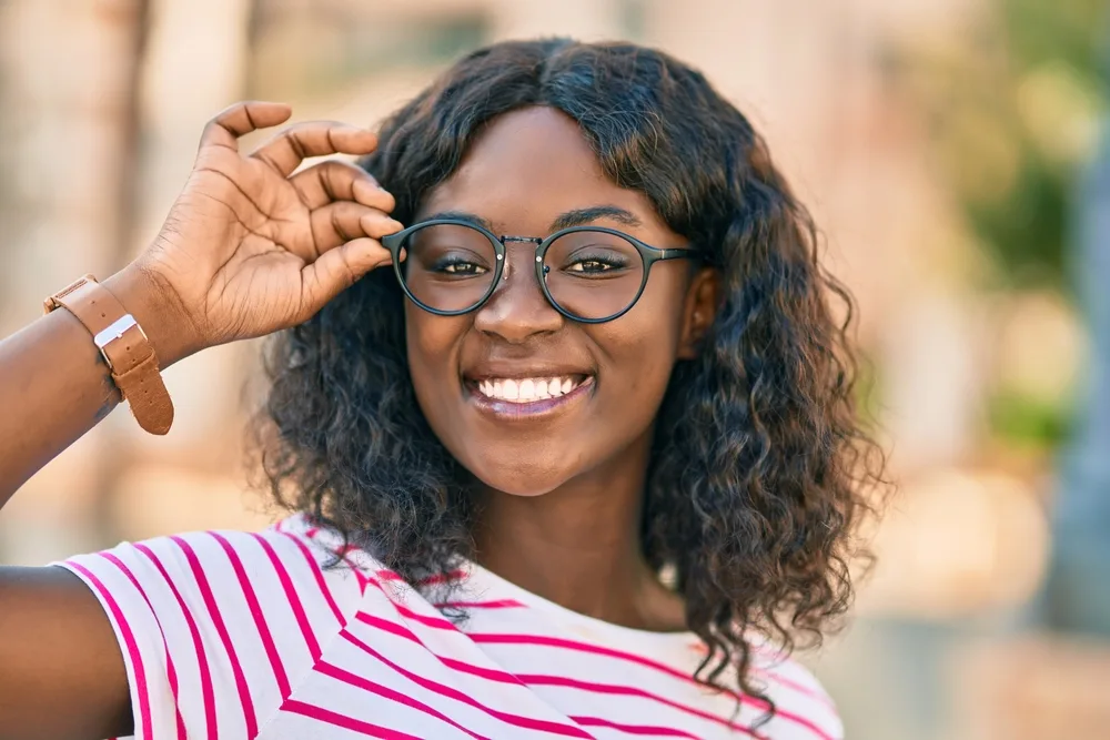 A natural-density wig worn by an African American female creates a cute voluminous look.