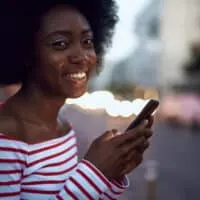 A black female with curly hair follicles after co-washing natural hair with a regular conditioner.