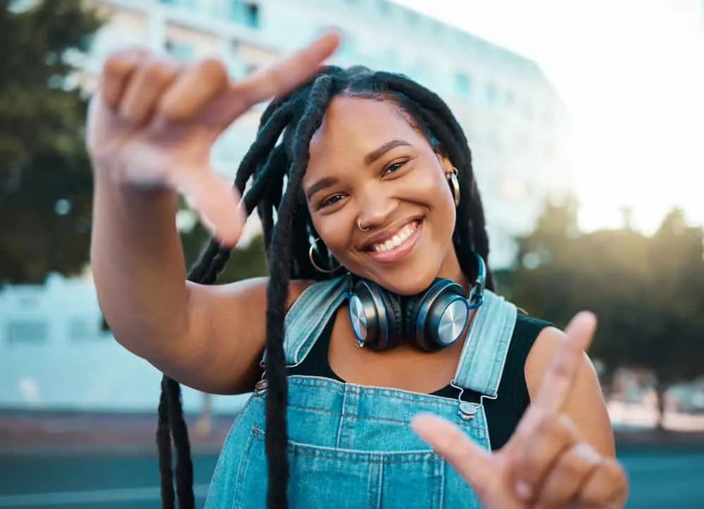 How Long Does It Take 4C Hair to Loc up With 4C Loc Phases 7 A black woman wearing adult locs started with two-strand twists is seeing good hair growth.