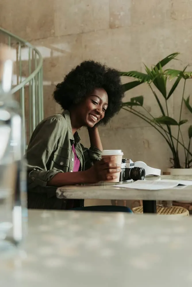 A beautiful black woman is experiencing rapid new hair growth after going natural.