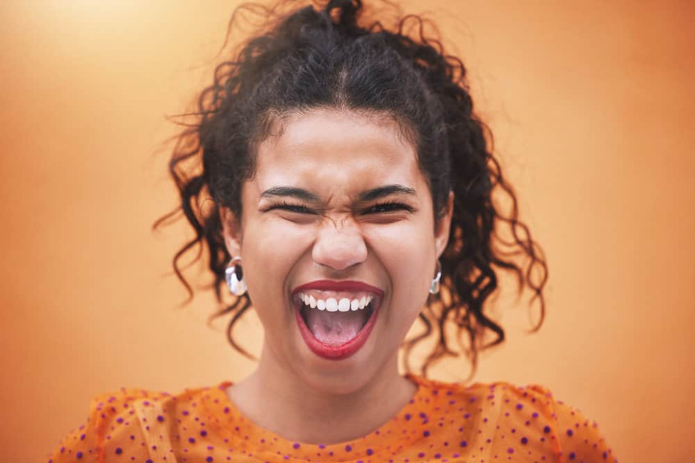 A beautiful woman with hair shaft damage and temporary hair loss from using bleach.