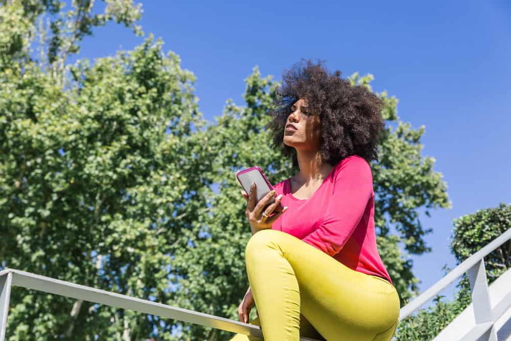 A cute black female cut her hair damp with household scissors instead of professional shears.