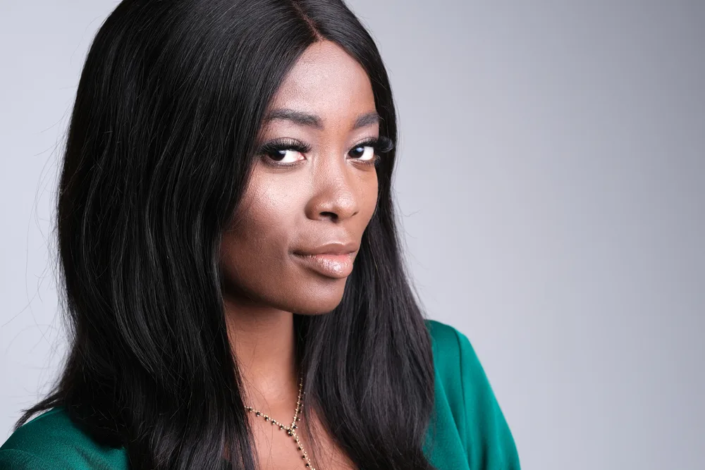 What Are Lace Wigs? How Long Do Lace Front Wigs Last on Head 5 A beautiful black girl with a great smile wearing a human hair wig that came in a satin sealable bag.