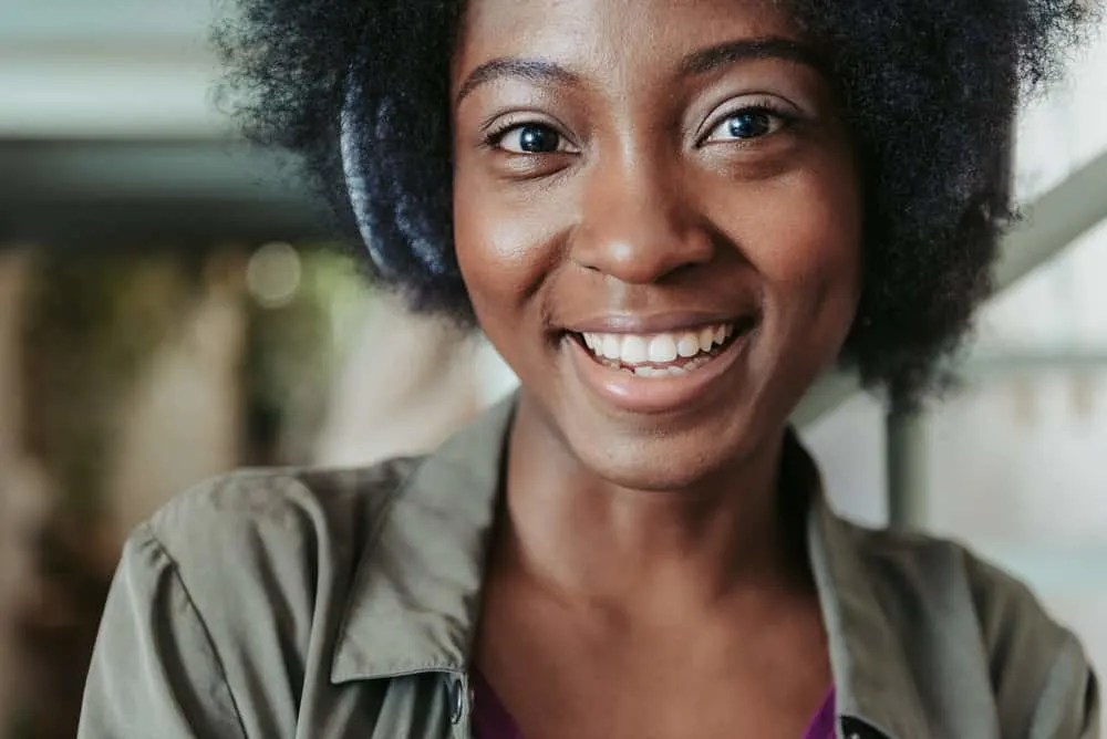 How to Grow 4C Hair Quickly: Longer, Faster, and Naturally 4 A cute African American female with kinky hair has tightly coiled strands styled with aloe vera gel.