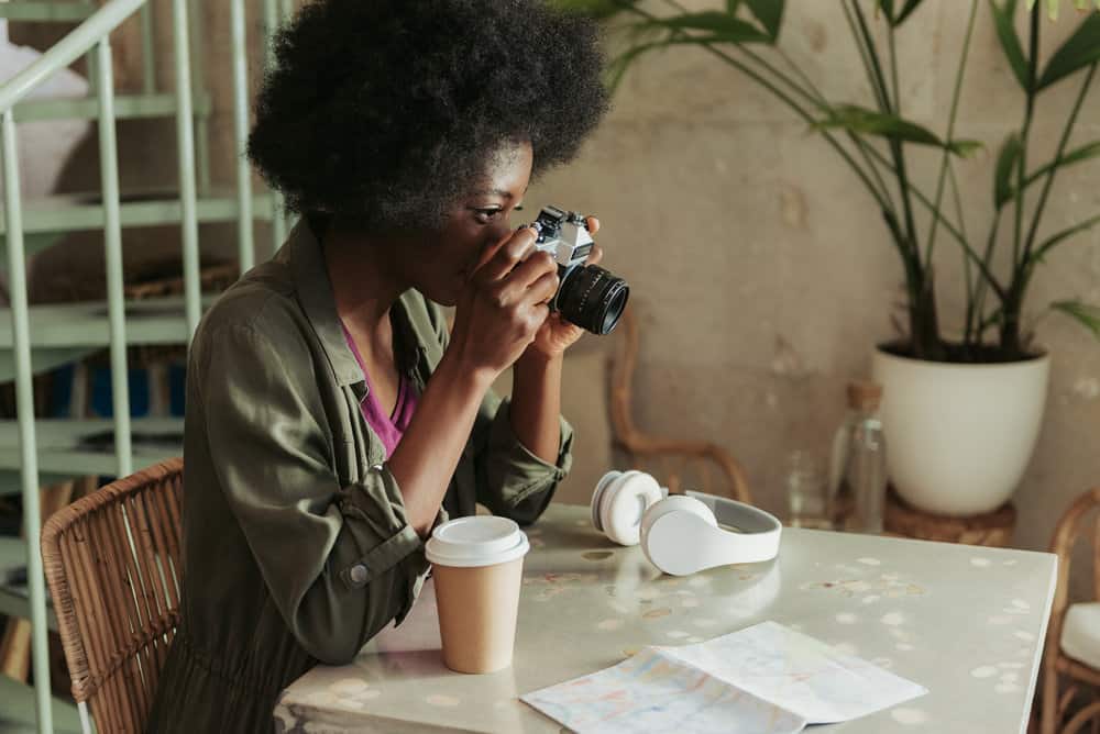 An African female that uses the curly girl method within her natural hair regimen due to low hair porosity.