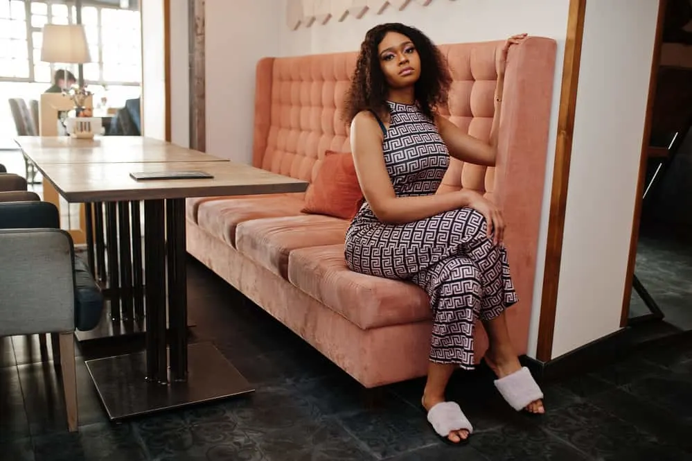 Best Wigs: Where to Buy Good Human Hair and Synthetic Wigs 6 A light-skinned black girl looks gorgeous wearing a wig cap made of human hair that boasts a realistic hairline.
