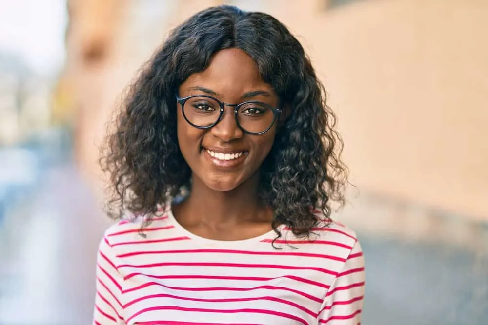 What Density Wig Should I Get? Wig Density Chart Comparison 1 A young African American female with naturally thin hair wearing a lower-density wig made from synthetic hair.