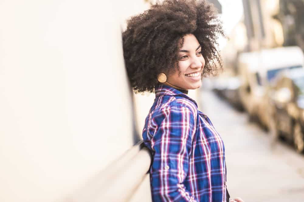 Embracing her curly, thick hair, she decided to brush curly hair wet but with care, using hair serum to gently detangle and define her beautiful curl pattern.