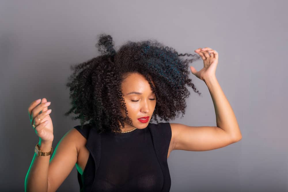 To speed up the drying process without causing heat damage, you can blow dry curly hair, creating the perfect environment for her hair cuticle to dry completely.