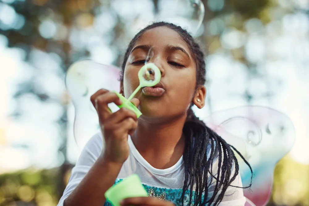 Box Braids for Kids: Do Kids Box Braids Hairstyles at Home 14 The little girl's medium box braids, expertly crafted by a professional hairstylist, showcase the versatility of kids braided hairstyles.