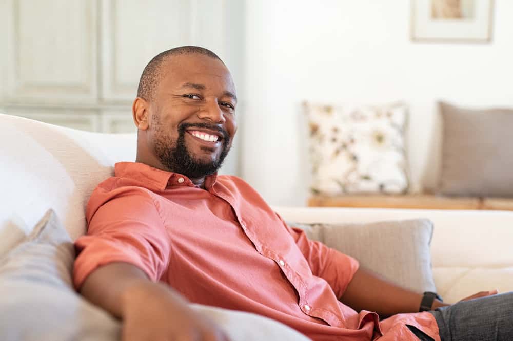 An African American man that's an experienced hair restoration expert at Bosley provides professional treatment options for severe hair loss.