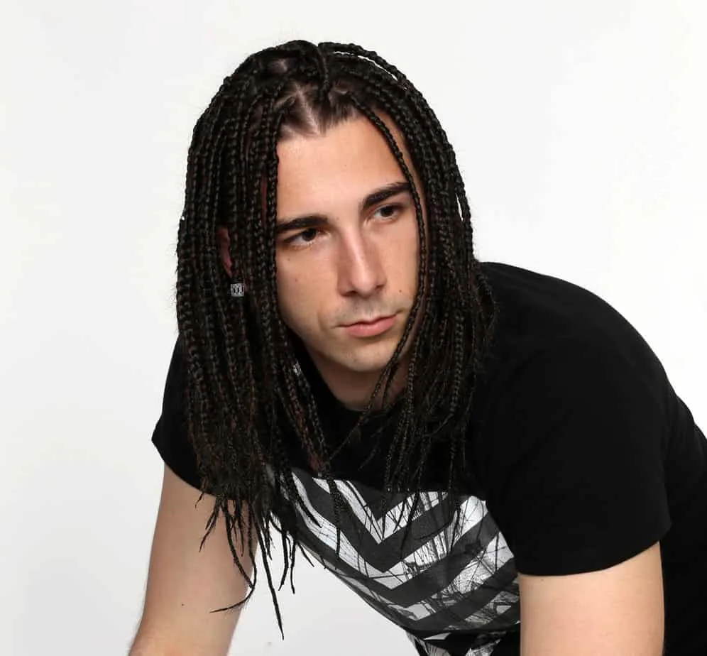 White Boy Braids: Braided Styles for Caucasian Men and Boys 15 With his braids neatly secured with hair ties and beads, the white man exudes a sense of confidence and admiration for the intricacy of braided hairstyles.