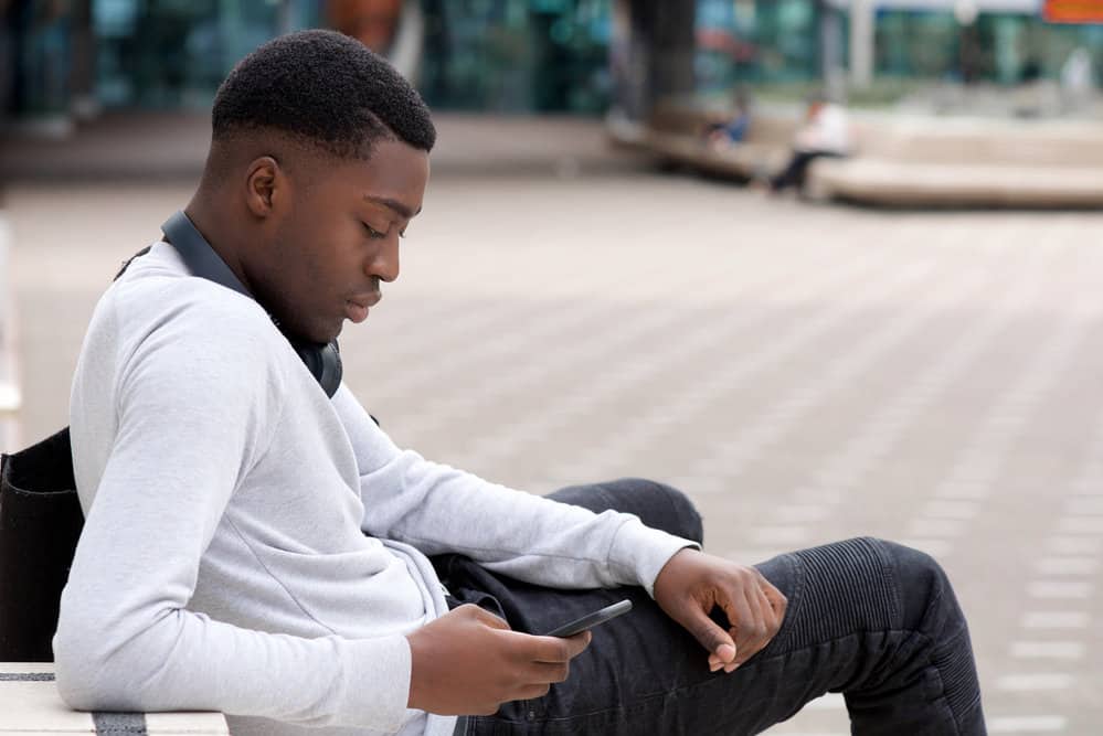 With a high bald fade and short hair on top, his haircut is both edgy and low-maintenance, perfect for men who don't want to fuss over their hair.