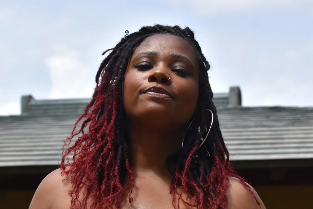 Butterfly Locs: How to Do Butterfly Loc Hairstyles at Home 23 A lady decided to install butterfly locs with a light and airy feel, loosely wrapped, creating a distinctive and stylish look.