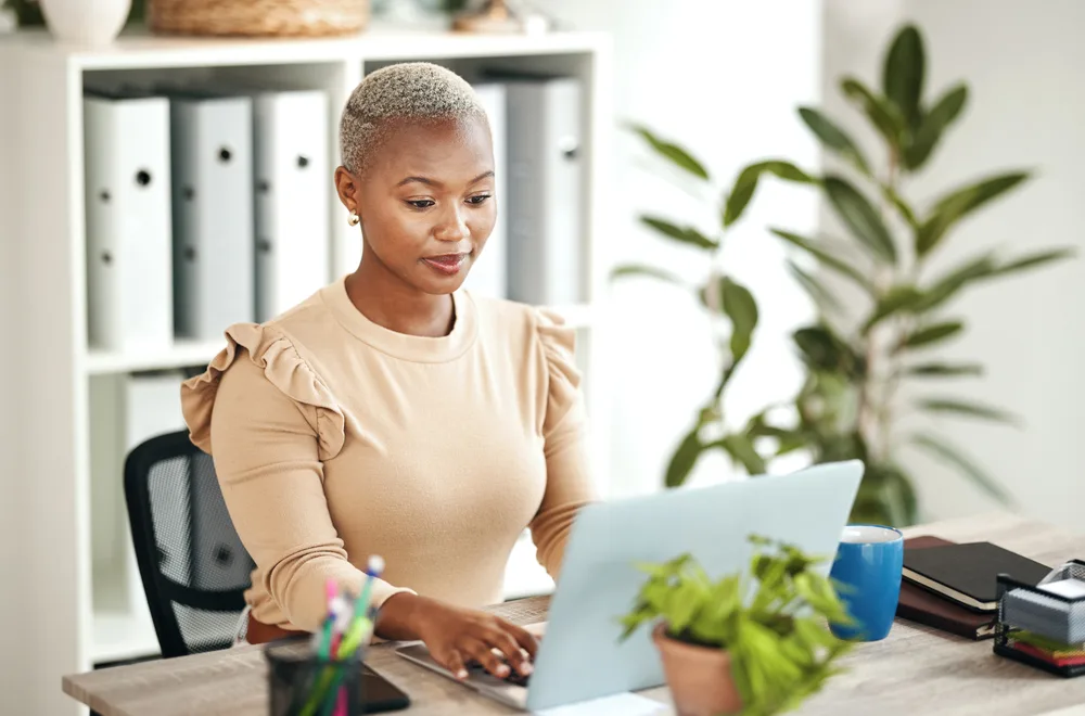 How to Go Back to Your Natural Hair Color After Dyeing Hair 8 Rocking a beautiful hair color transformation, the African American woman dons a lighter shade that seamlessly blends with her natural roots for a flawless look.