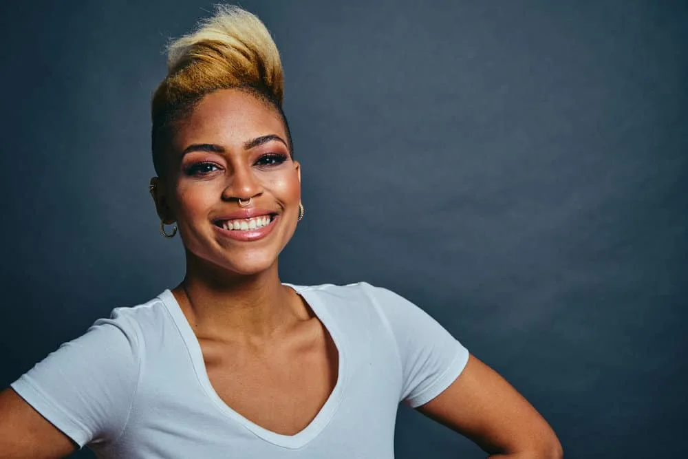 How to Dilute 40-Volume Developer to 20: DIY Diluting 5 The African American female's hair is transformed into a beautiful blonde with the correct dilution and use of hair dye, hydrogen peroxide, and hair developer volume.