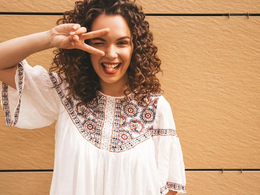 Digital Perm: What Are Digital Perms and How Do They Work? 4 With her healthy hair flowing in soft waves, the white beauty emanates confidence and joy, a testament to the magic of a digital perm.