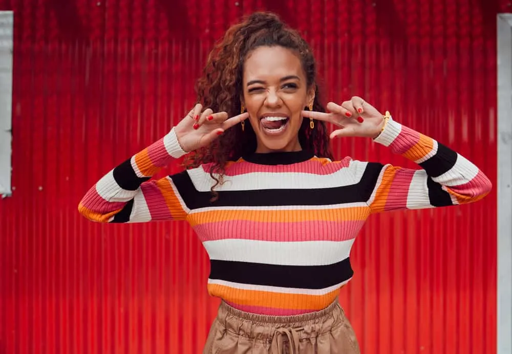 How to Get Curly Hair: Make Curls More Defined and Last All Day 6 Embracing the curly hair lifestyle, she enhances her natural curl pattern by applying sea salt spray and natural oils to her wet hair.