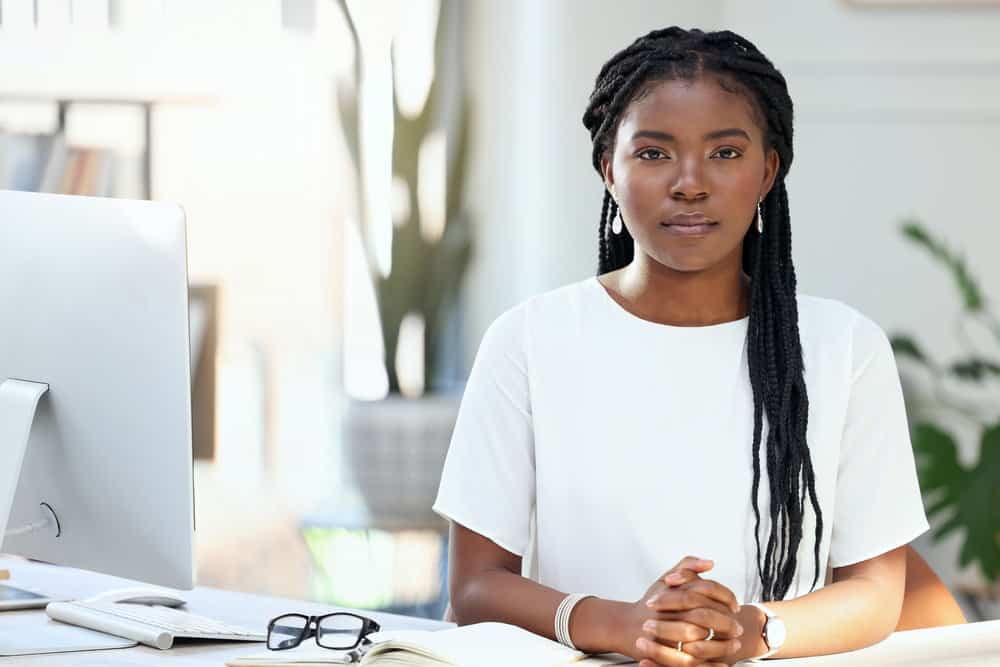 Her knotless braids give her the freedom to experiment with various braided hairstyles, from wearing them loose to creating unique updos.