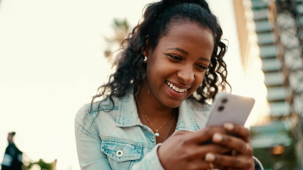 With a wide tooth comb, she finger combs her wavy hair, gently detangling it without disrupting her natural wave pattern.