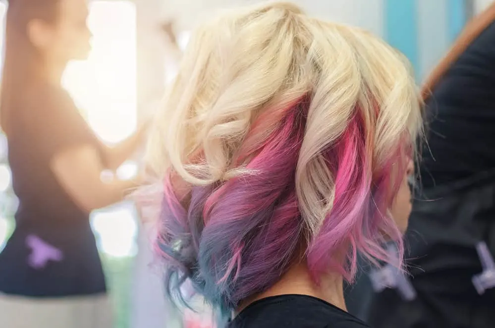 8 Underdye Hair Coloring Trends, Ideas, and Hairstyle Tips 18 The caramel blonde highlights beautifully complement his skin tone, creating a warm and harmonious combination.
