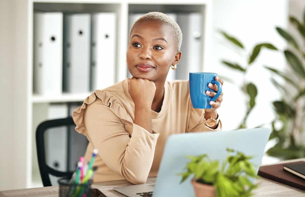 With her hair expertly dyed by a hair colorist in a blonde semi-permanent color, the African American lady effortlessly captures attention with her radiant look.