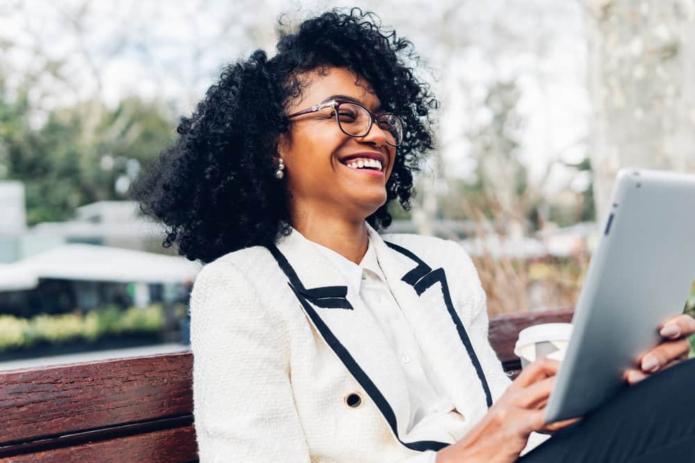 She embraces her own natural curly hair texture, using coconut oil to moisturize her curls and prevent frizz and split ends.