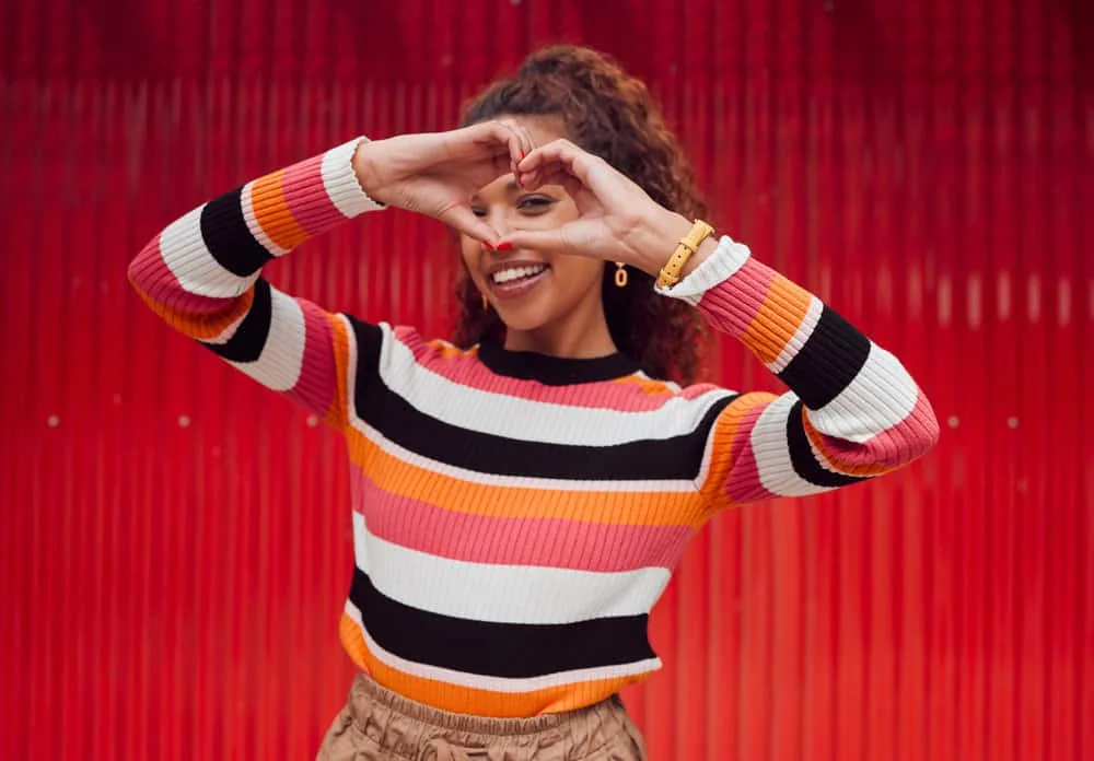 How to Get Curly Hair: Make Curls More Defined and Last All Day 8 The frizzy hair is tamed as she applies sea salt spray and natural oils, transforming her hair into a crown of glorious, healthy curls.