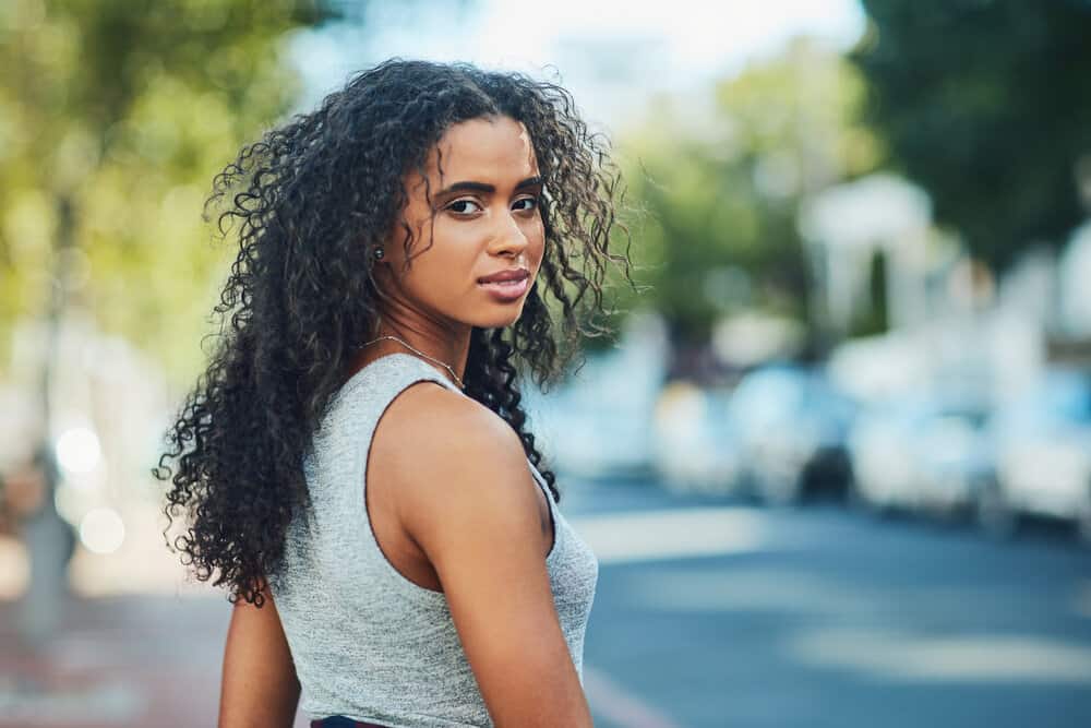 Despite her efforts to achieve a flawless look, the natural curls of the stunning black lady succumbed to frizz after applying heat and styling products.