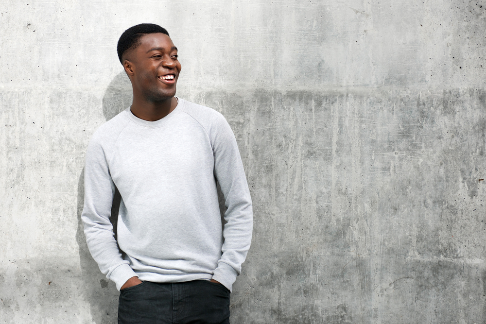 The high point of his haircut is the brushed-up top, adding a modern twist to the classic crew cut.