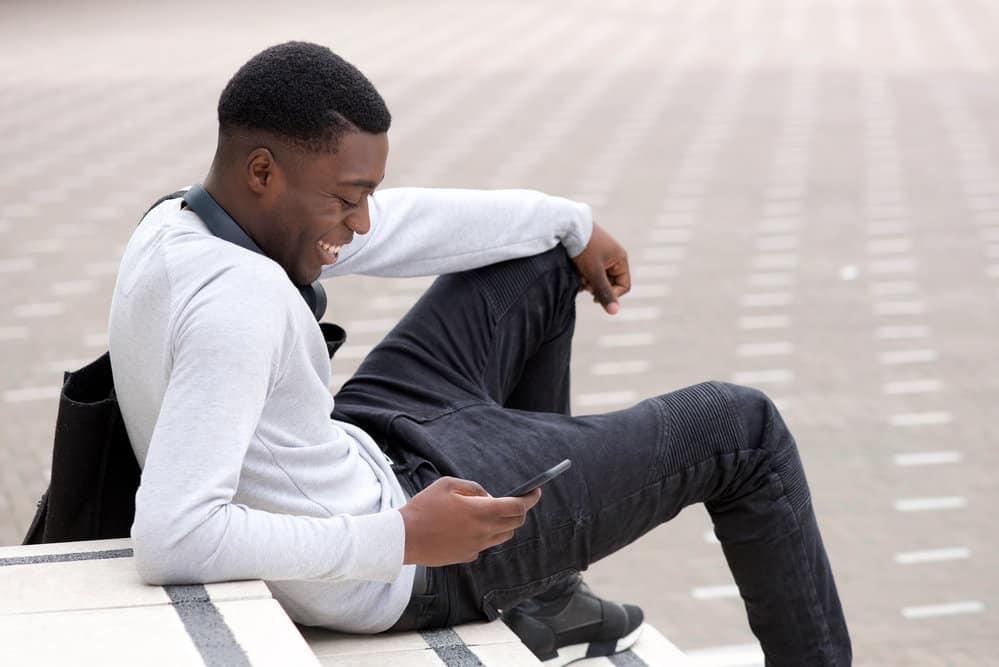 The black man's haircut involves brushing the hair forward to create a messy but stylish haircut that's perfect for any occasion.