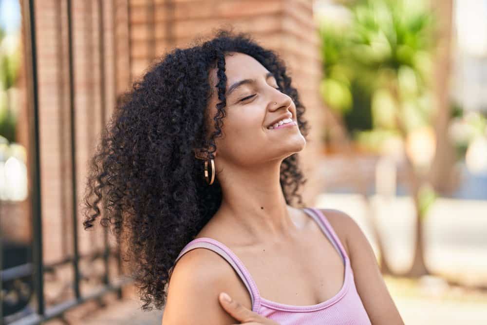 Despite her below-average rate of hair growth, she takes steps to nourish her hair and promote healthier growth.